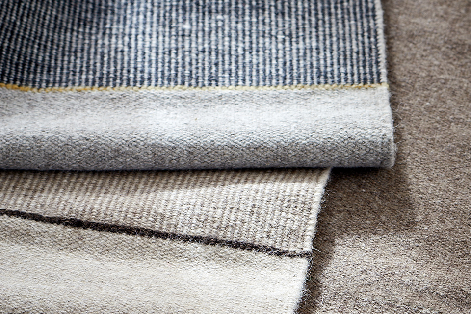 Teppichmuster in den Farben Blau, Braun und Beige